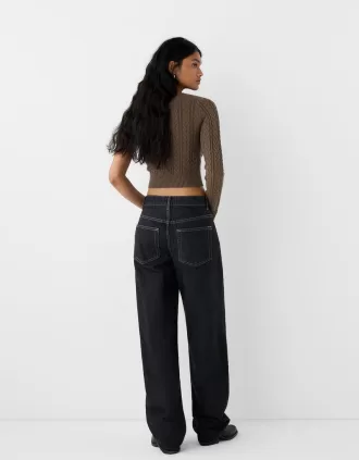 Asymmetric cable-knit sweater