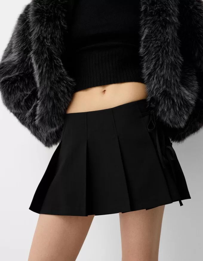 Box pleat mini skirt with bow detail Box pleat mini skirt with bow detail