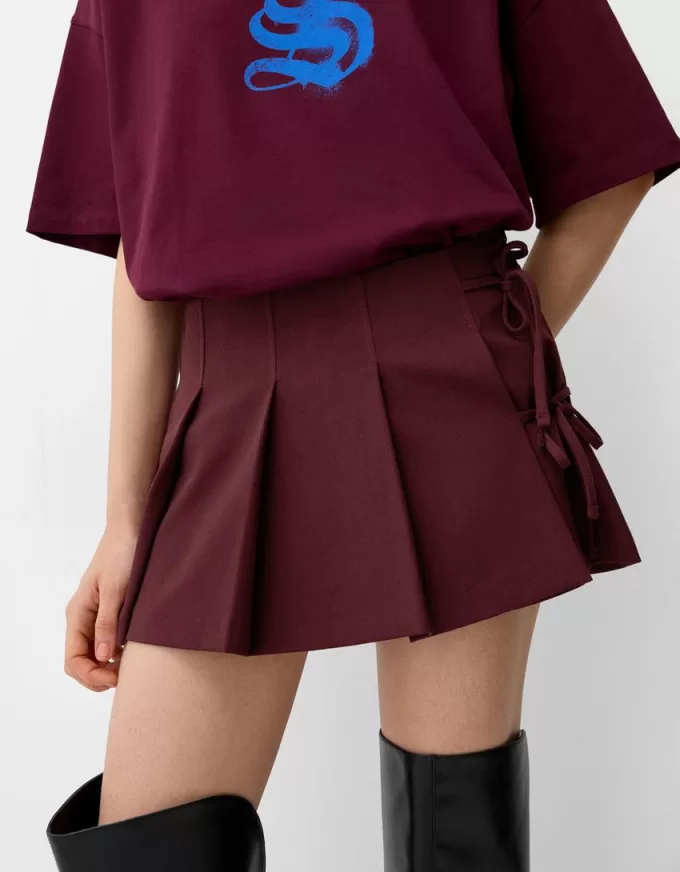 Box pleat mini skirt with bow detail Box pleat mini skirt with bow detail