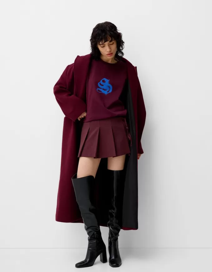 Box pleat mini skirt with bow detail Box pleat mini skirt with bow detail