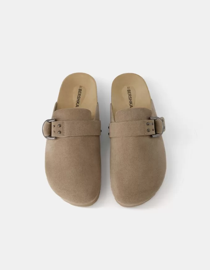 Buckled clogs with stud details