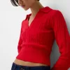 Cable-knit polo collar sweater