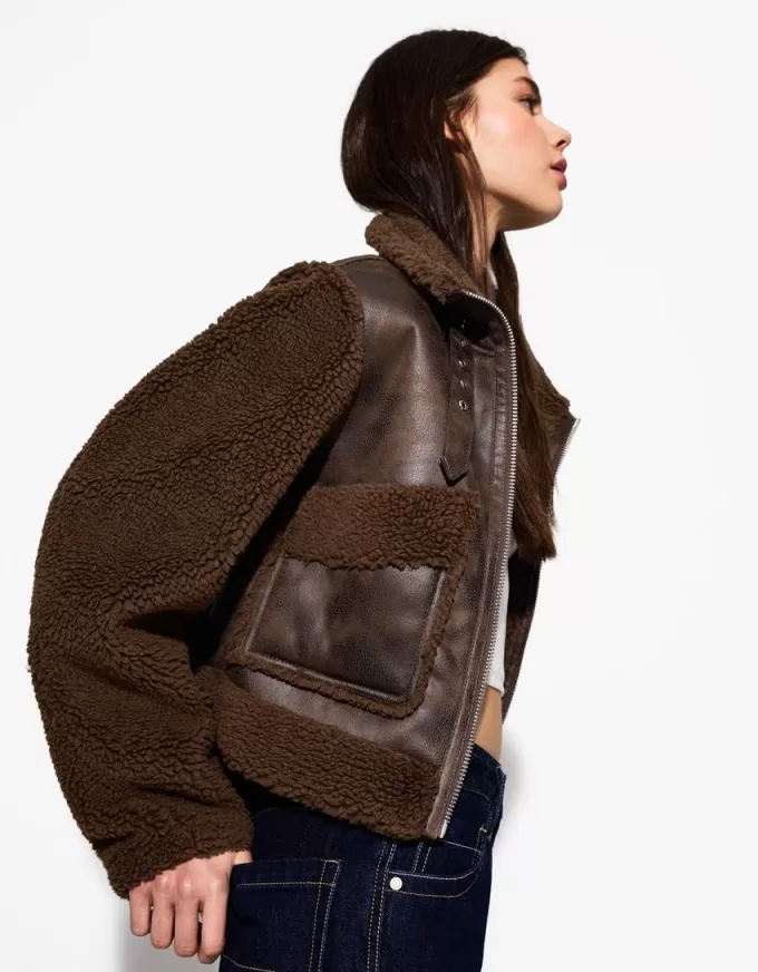 Double-sided jacket with faux shearling sleeves Double-sided jacket with faux shearling sleeves