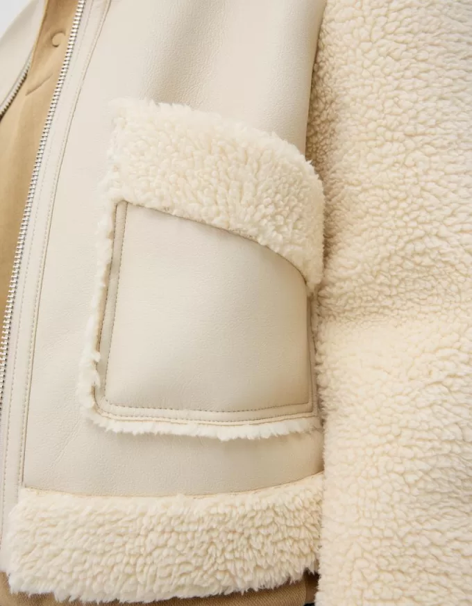 Double-sided jacket with faux shearling sleeves Double-sided jacket with faux shearling sleeves