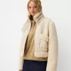 Double-sided jacket with faux shearling sleeves Double-sided jacket with faux shearling sleeves