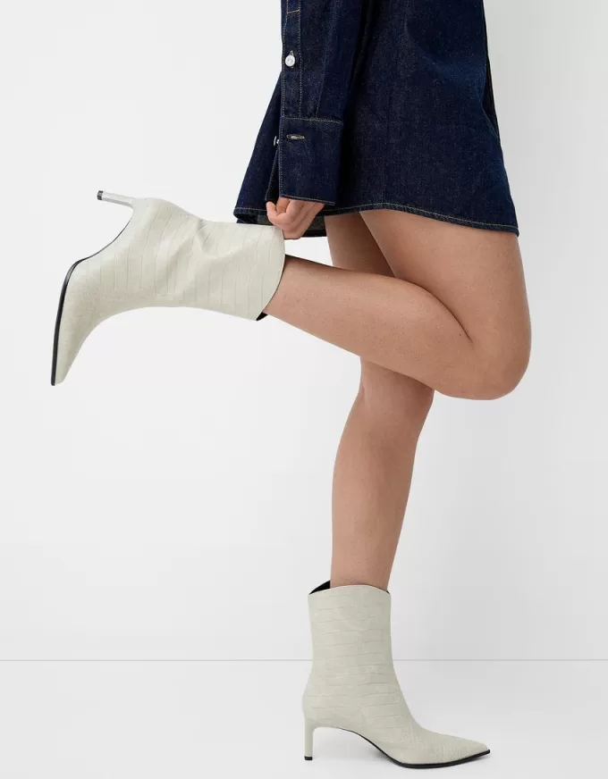 Embossed animal print heeled ankle boots