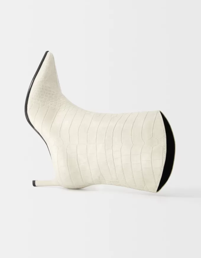 Embossed animal print heeled ankle boots