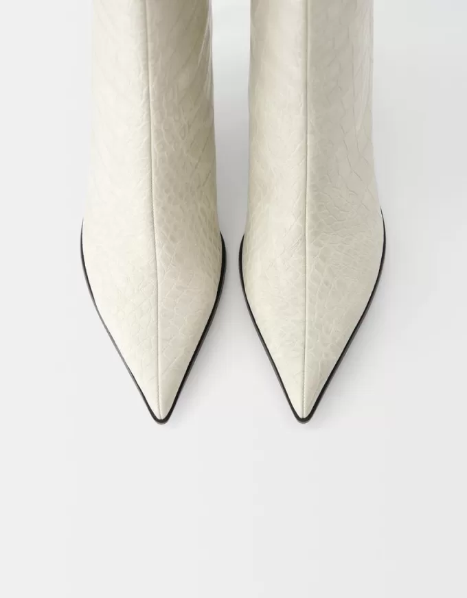 Embossed animal print heeled ankle boots