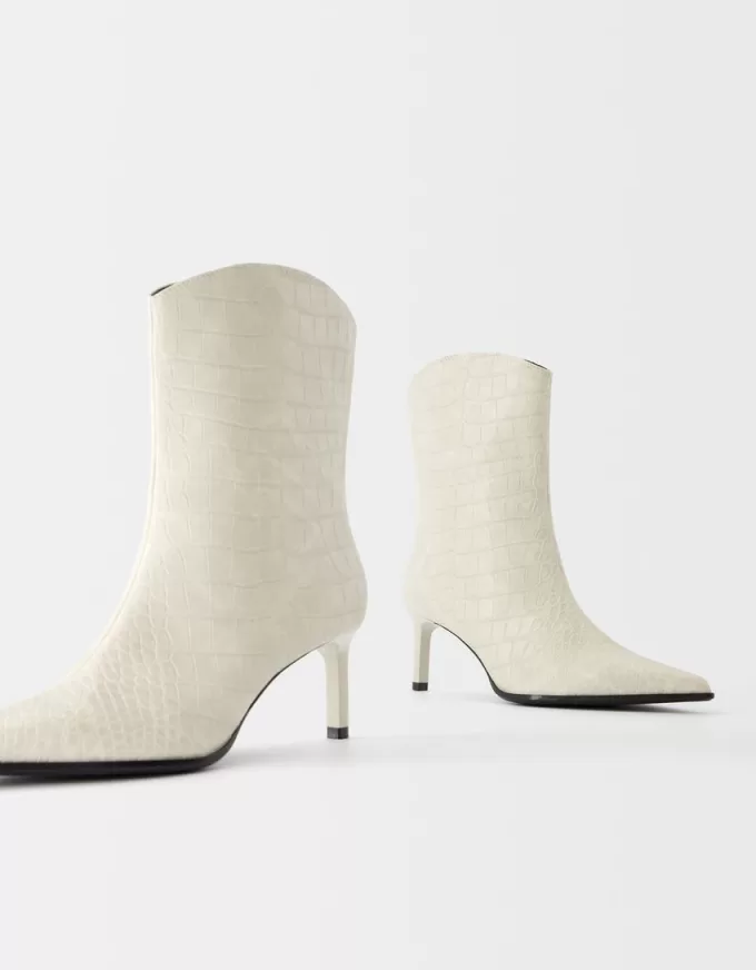 Embossed animal print heeled ankle boots