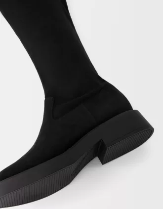 Flat fitted knee-high boots