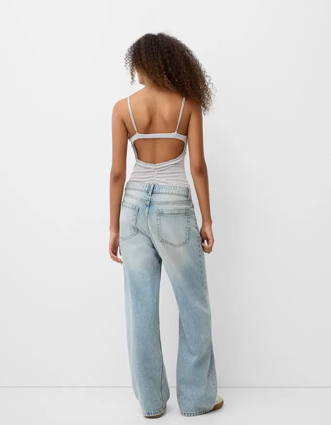 Ruffled bodysuit with straps