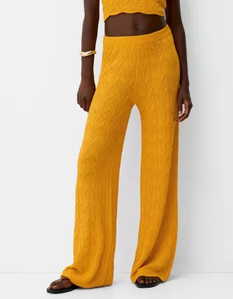 Rustic open knit flared pants