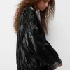 Shiny effect bomber jacket with over print