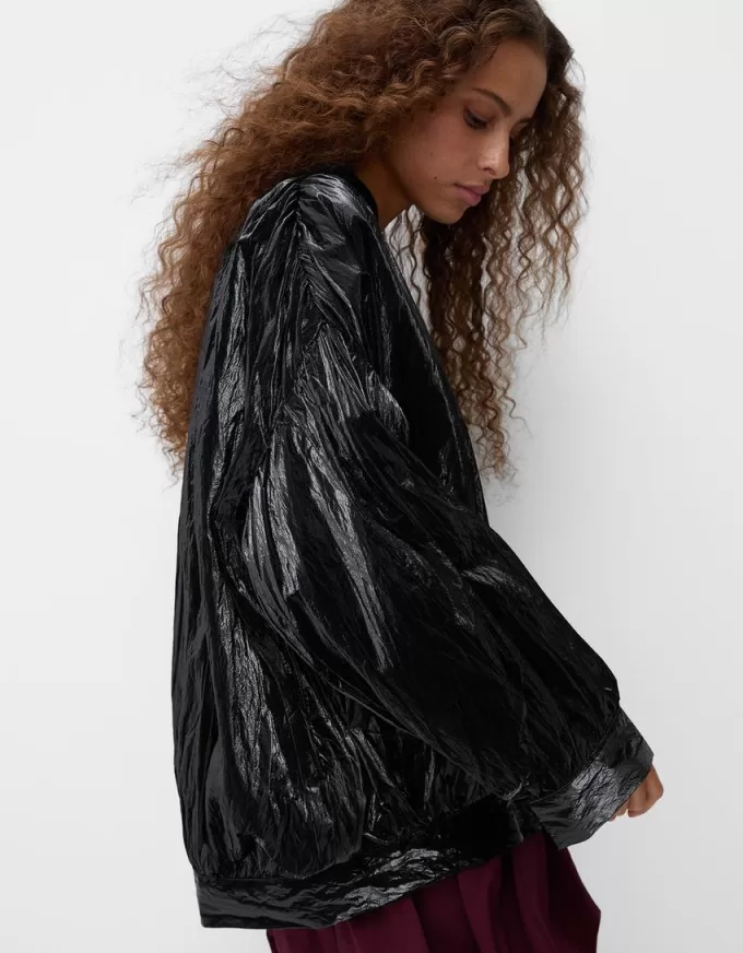 Shiny effect bomber jacket with over print