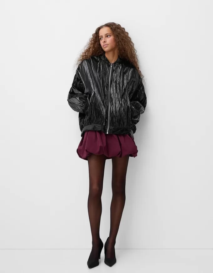 Shiny effect bomber jacket with over print