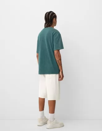 Short sleeve faded-effect T-shirt with a print