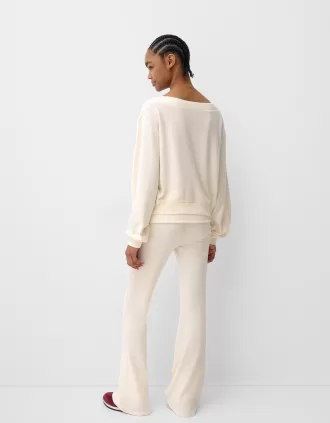 Soft touch asymmetric neck sweater