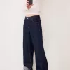 Wide-leg ’90s jeans with turn-up hems