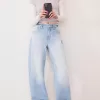 Wide-leg ’90s jeans with turn-up hems