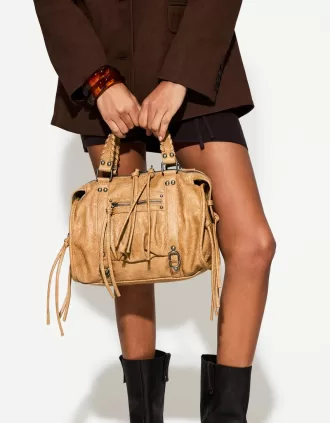 Worn-effect bowling bag with straps